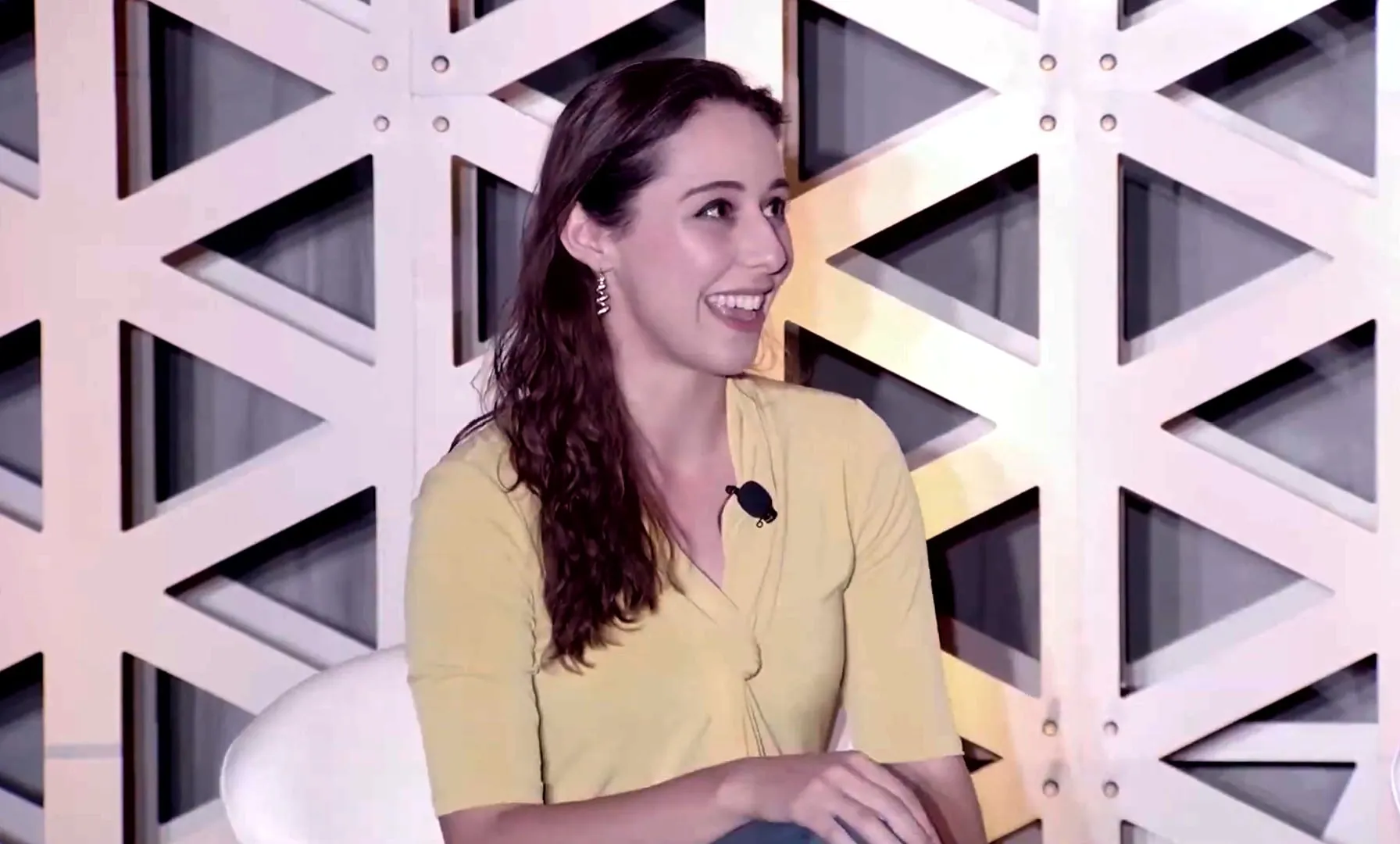 Erica laughing as she speaks on the WattCon panel